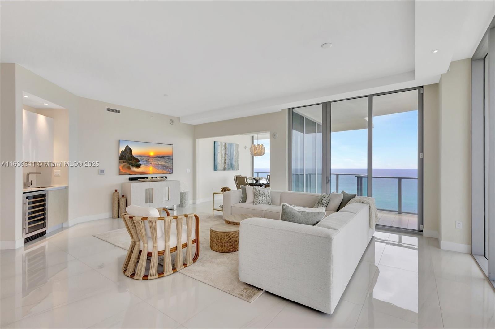 Enjoy the luxury and amenities of The AmritOcean Resort and Spa from your own private residence. This fully furnished, turnkey ready condo has SE ocean views and features more than 2,000 sq ft of living space and a 590 sq ft wrap around ocean view. Decorator furnished with contemporary fixture and finishes, this 2 bedroom,2.5 bath condo features imported flooring throughout, custom European kitchen and quartz stone countertops. Master bath with imported flooring with double vanity quartz countertops and custom telework.Spacious custom walk-in closets with built-ins.Custom black out drapes & electric shades throughout.Full sized laundry room. Water filtration system.Imported silk & natural fiber area rugs. Custom furniture.Ready to move in immediately, this is a must see.