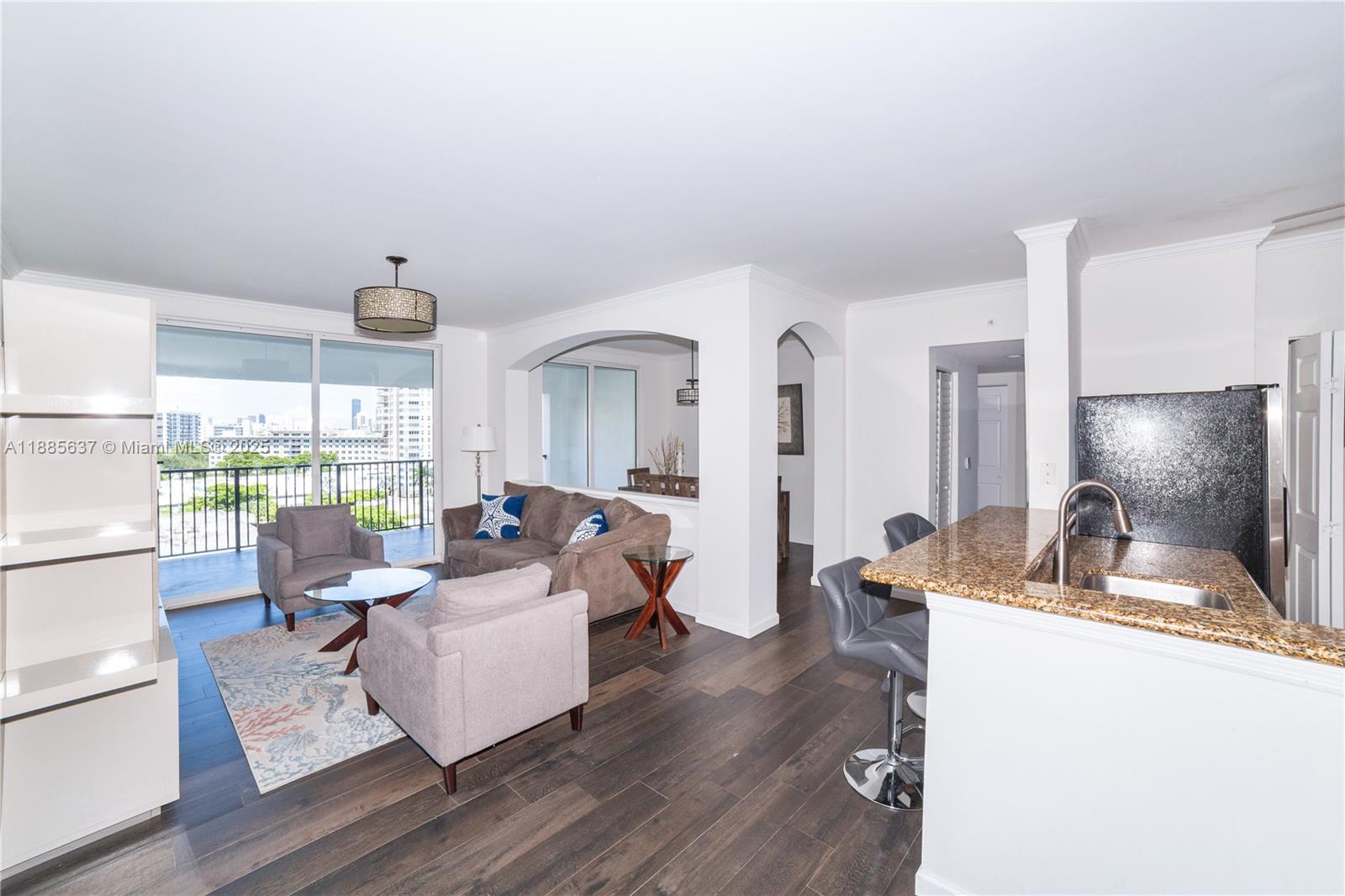 Immaculate and spacious corner penthouse unit, boasting 3 bedrooms & 2 bathrooms in one of the largest floorplans available. This beautifully renovated apt features soaring high ceilings, elegant tile flooring, and a freshly remodeled master bath with premium finishes. The upgraded closets offer abundant storage, while the tasteful furnishings make this unit truly move-in ready. Enjoy breathtaking views of the canal, ocean, and Intracoastal, along with the unique charm of a fixed pedestrian bridge, all from your private, light-filled sanctuary. Located in a pet-friendly Mediterranean Style building, with luxury resort-style amenities. Covered, assigned parking space. Prime location, just steps from the beach, fine dining, shopping, entertainment, top-rated A schools & more. Do not miss it!