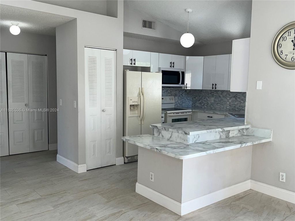 Photo of 2825 Stoneway Ln #B, Fort Pierce, FL 34982 (MLS # A11525506)