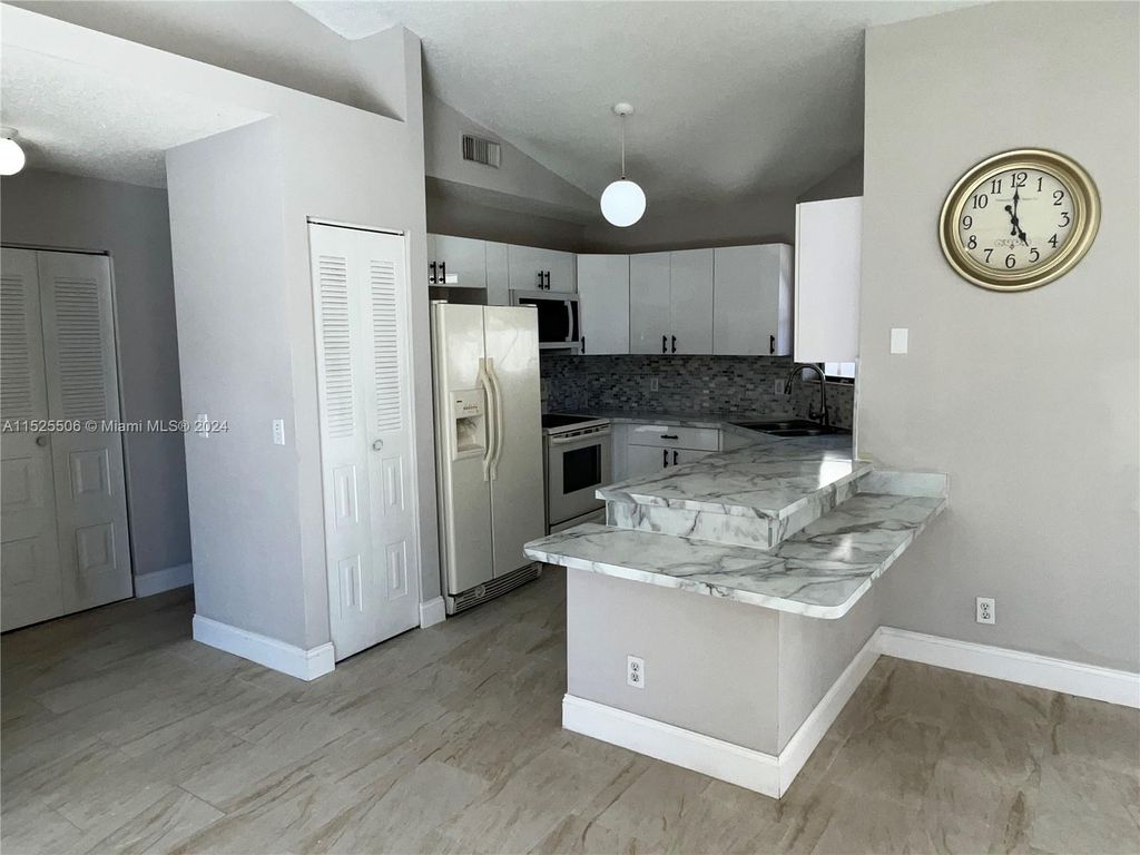 Photo of 2825 Stoneway Ln #B, Fort Pierce, FL 34982 (MLS # A11525506)