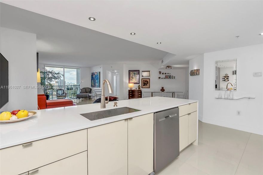 Stunning fully renovated 2 bedroom 2 bathroom featuring large white tile throughout this large spacious open space, great for entertaining all your friends and family. Fully updated bathrooms both offering walk-in showers with custom made vanities with lots of storage. Modern fully updated kitchen with large waterfall island includes stainless steal appliances, kitchen aide induction cooktop with convection oven. Air conditioner is just shy of 2 years old Large stackable frontload washer and dryer. Breathtaking unobstructed downtown views.  Building offers: 2 heated pools, jacuzzi, 2 gyms, clubroom, saunas, 24 hour concierge, 24 hour valet and 24 hour security patrol. FOB secured building. Walk to Dadeland Metro Station South, Publix, Trader Joes, Dadeland Mall and all up and coming Restaurants.