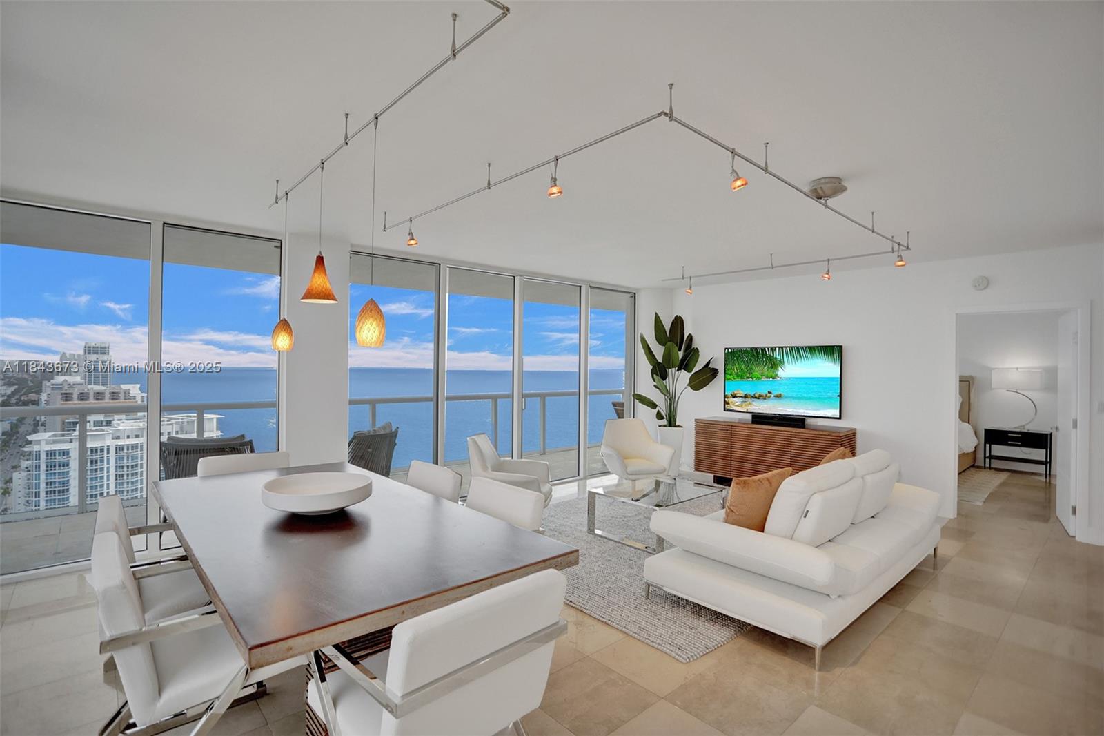 This two-bedroom, two-bathroom apartment boasts a breathtaking 270-degree view of both the ocean and the city. With its modern and renovated design, the apartment is perfect for those seeking a comfortable and stylish living space. The unit comes fully furnished, providing everything you need for a comfortable stay. The contemporary furnishings complement the sleek design of the apartment, making it the perfect place to relax and unwind. The ocean and city views are simply stunning and provide a constant reminder of the beauty of the surrounding area. Whether you're enjoying a morning coffee or relaxing on the balcony, the view will never cease to amaze you. Overall, this apartment offers the perfect combination of comfort, style, and natural beauty.