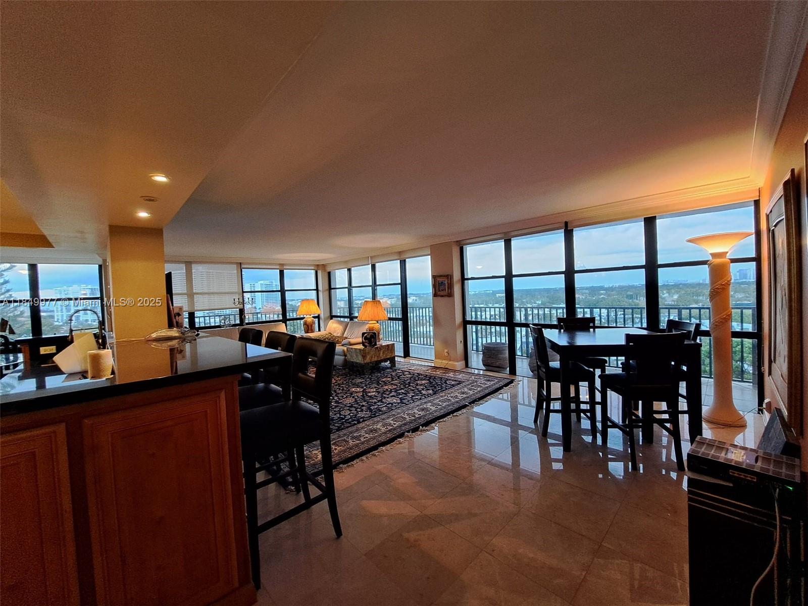 Discover coastal living at its finest in this beautifully appointed 2-bedroom, 2-bathroom corner condo in the heart of Hallandale Beach’s exclusive Three Islands community. Spanning approximately 1,430 sq. ft., this spacious residence boasts floor-to-ceiling windows and a private wraparound balcony, offering breathtaking views of the Intracoastal, city skyline, and beyond. Located just steps from Hallandale’s pristine beaches, this condo offers unparalleled access to shopping, dining, parks, and entertainment, including Aventura Mall, Hard Rock Stadium, and nearby casinos. Enjoy resort-style amenities such as a heated pool along the Intracoastal, tennis courts, fitness center, BBQ area, clubhouse, and 24/7 security.