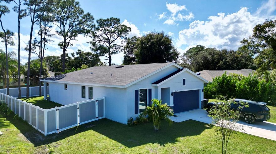 2024 CBS construction 3BD, 2BA home with impact glass, a designer look, and split floor plan. Set on a quiet street, this stylish residence offers a spacious open layout with LED lighting, impact windows, and a 2-car garage and fenced backyard. Plenty of room to bring your toys, truck, or boat! Just a short drive to the beach, inlet, dining, and shopping. Tenant occupied through Jan 2026. Sizes approx/subject to error.