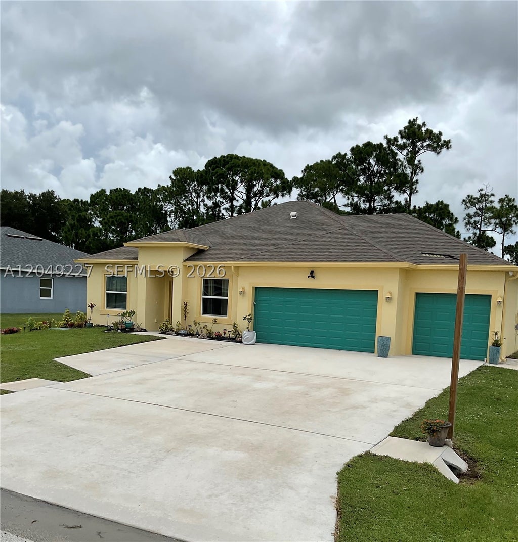 Photo of 6157 NW Gatun Dr, Port St Lucie, FL 34986 (MLS # A12049227)
