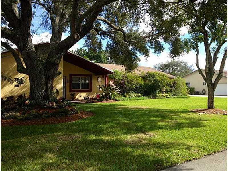 Three bedroom two bath home with nice layout on large lot. Tiled throughout, newer kitchen with stainless steel appliances, covered terrace overlooking pool and yard. Rent includes pool maintenance.