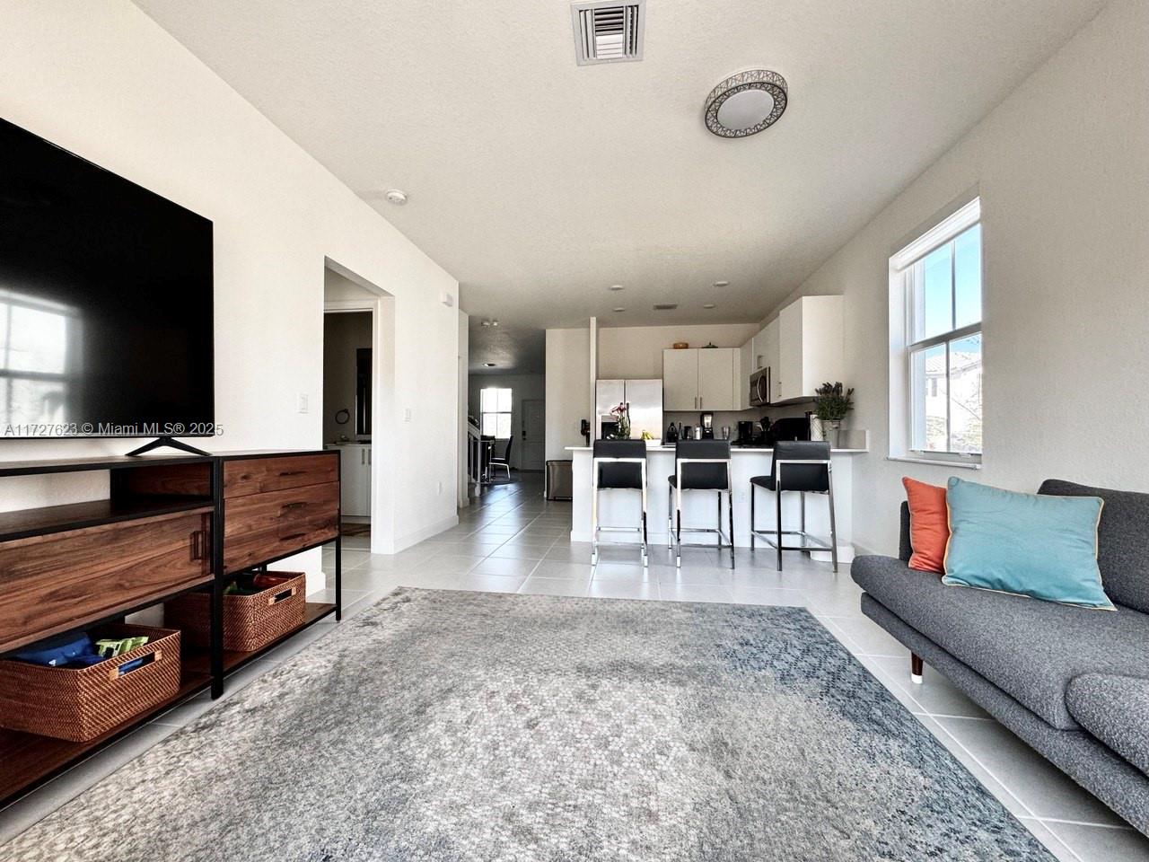 Welcome to this four-bedroom, two-story corner townhouse, boasting the largest floor plan available in Sunset Trails community (A/C area 1,974, total area 2,252 sq ft). This residence offers modern living with numerous upgrades, including an automated garage door, EV charger, remote-controlled backyard awning, newly paved backyard area, a brand-new washer and dryer, lighting and double layer blackout roller shades in the bedrooms.
The community's location provides easy access to the Sawgrass Expressway. Families will appreciate the proximity to award-winning schools, including Coral Springs Charter School, Eagle Ridge Elementary School, Coral Springs Middle School, and Marjory Stoneman Douglas High School.