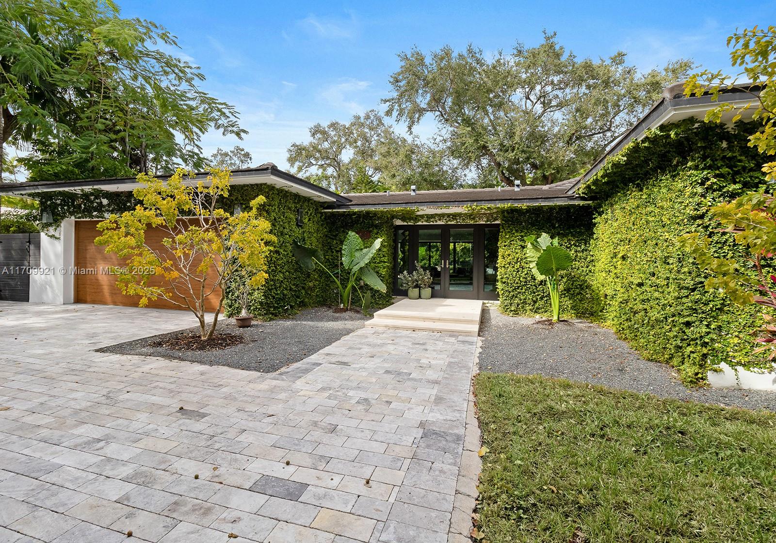 Nestled in the Coconut Grove neighborhood of Bay Heights, this fully renovated home offers a perfect blend of comfort and charm with modern conveniences. Enjoy the open living area with 15’ vaulted ceilings and stacked impact sliding doors that open up completely to the outside. A spacious, open kitchen offers Miele appliances and Krion counter tops, and the newly built master suite indulges you with a large walk-in closet and luxurious bathroom. The generous back yard invites you to spend time in the pool, or rest on the patio shaded by a lovely oak tree. Conveniently located close to the lush parks, trendy boutiques, and charming cafes of Coconut Grove, the MIA airport, the vibrant Brickell area, and near some of the best schools in Miami.See video walk-through link above.