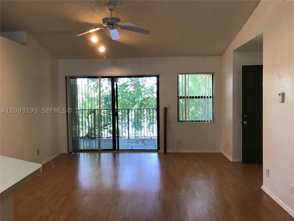 Photo of 9999 Summerbreeze Dr #1018, Sunrise, FL 33322 (MLS # A12093193)