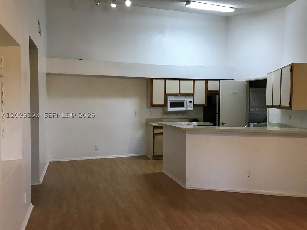 Photo of 9999 Summerbreeze Dr #1018, Sunrise, FL 33322 (MLS # A12093193)