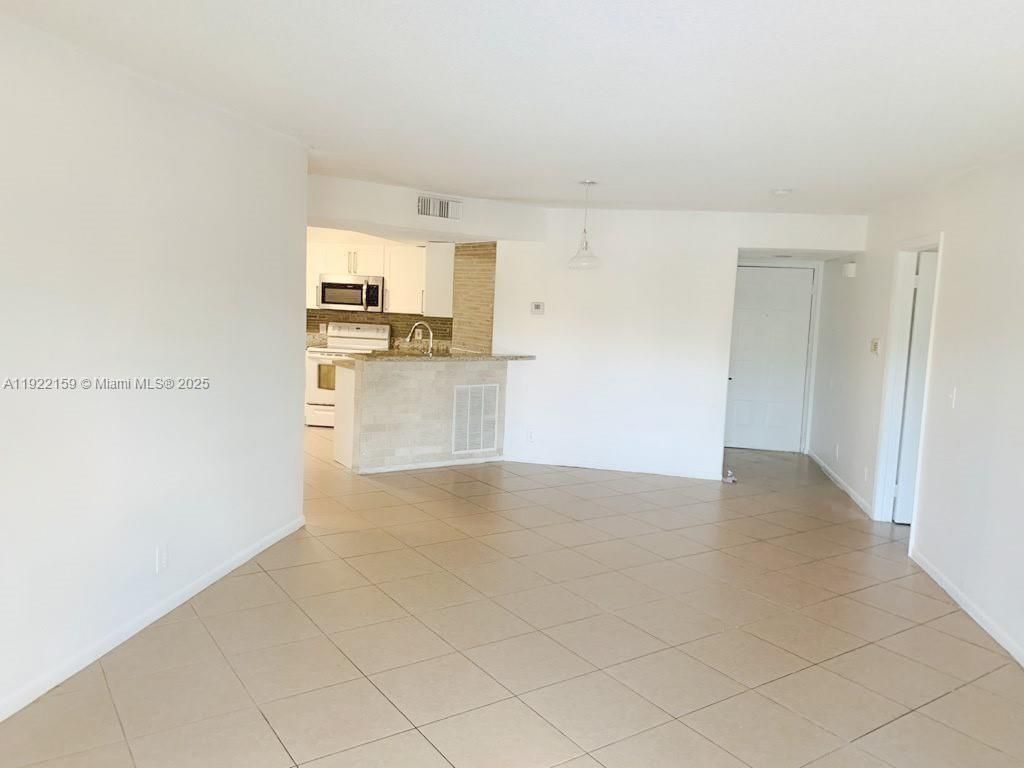 Photo of 8851 Wiles Rd #204, Coral Springs, FL 33067 (MLS # A11922159)