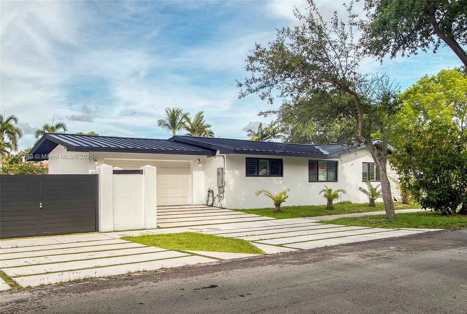 This fully renovated 4BD/3BA pool home in Miami Shores offers 2,600+ SF of elegant living. Designed for the discerning buyer, it features a spacious formal living/dining area and a chef’s kitchen with a marble island, custom cabinetry, and high-end appliances. The split-bedroom layout includes a luxe primary suite with dual walk-in closets and a spa-style bath. Enjoy impact windows/doors, a steel roof, LED lighting, Italian porcelain floors, and new fencing. Timeless elegance meets modern appeal. Walking distance to magnet schools nestled on a close-knit residential neighborhood.