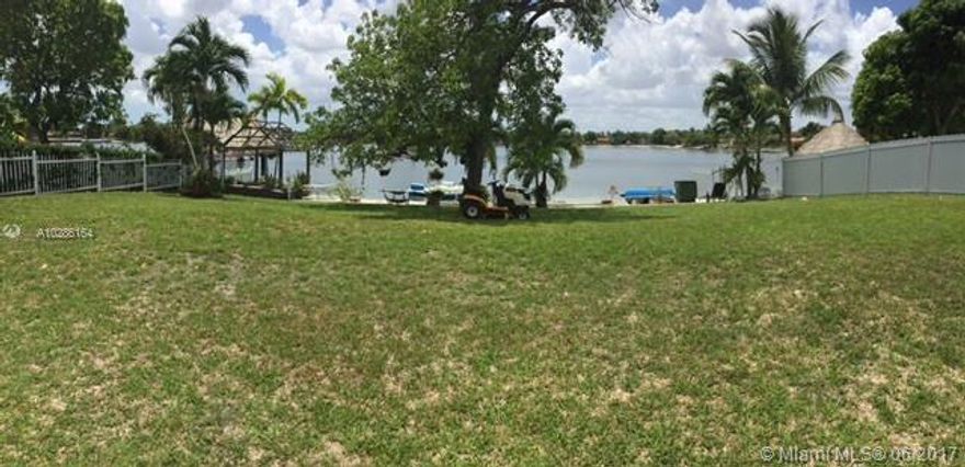 LAKEFRONT PROPERTY. SPECTACULAR SANDED AREA TIKI HUT AND BBQ. BRING YOUR PICKIEST CLIENTS. HAS IMPACT WINDOWS AND A NEW ROOF AND IT'S GORGEOUS INSIDE, GREAT VIEWS TO THE LAKE