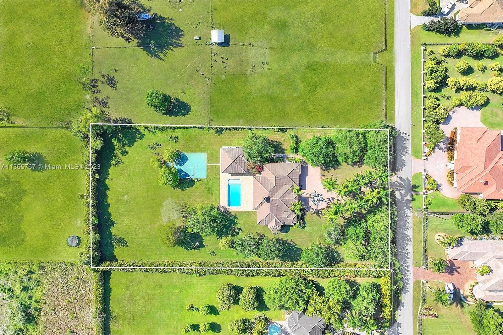 WELCOME TO THE UNIQUE EQUESTRIAN FRIENDLY TOWN OF SW RANCHES FEATURING THIS SPECTACULAR 4,663 SQ FT ESTATE HOME SITUATED ON A SPRAWLING 2.2 ACRES. AN ELEGANT WINDING DRIVEWAY LEADS TO THE MODERN MEDITERRANEAN PARADISE SHOWCASING HAND MADE SALTILLO FLOORS, CUSTOM WINDOW TREATMENTS, BRILLIANT OPEN PLAN, & ARCHITECTURAL DETAIL. CUSTOM CHEF'S KITCHEN W BAR BOASTS RARE BRAZILIAN BLUE QUARTZITE COUNTERS & VIKING APPLIANCES. LUXURIOUS PRIMARY SUITE W PRIVATE ACCESS TO GROUNDS. ENSUITE SPA RETREAT BATH HAS 2 VANITIES & GARDEN TUB. MAIN HOUSE ALSO HAS JR. SUITE W CABANA BATH, JACK & JILL & OPTIONAL 5TH BEDROOM/DEN/OFFICE. PRIVATE OUTDOOR OASIS HOSTS CHARMING TRELLISED PERGOLAS, LANAI, OVERSIZED HEATED SALT WATER POOL, SUMMER KITCHEN, BASKETBALL COURT + 1,089 SQ FT GUEST HOUSE W KITCHENETTE & BATH.