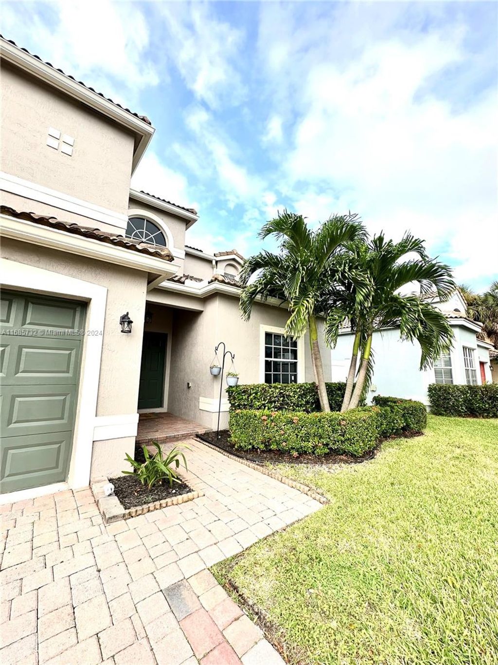 Photo of 4011 NW 62nd Ct, Coconut Creek, FL 33073 (MLS # A11685732)