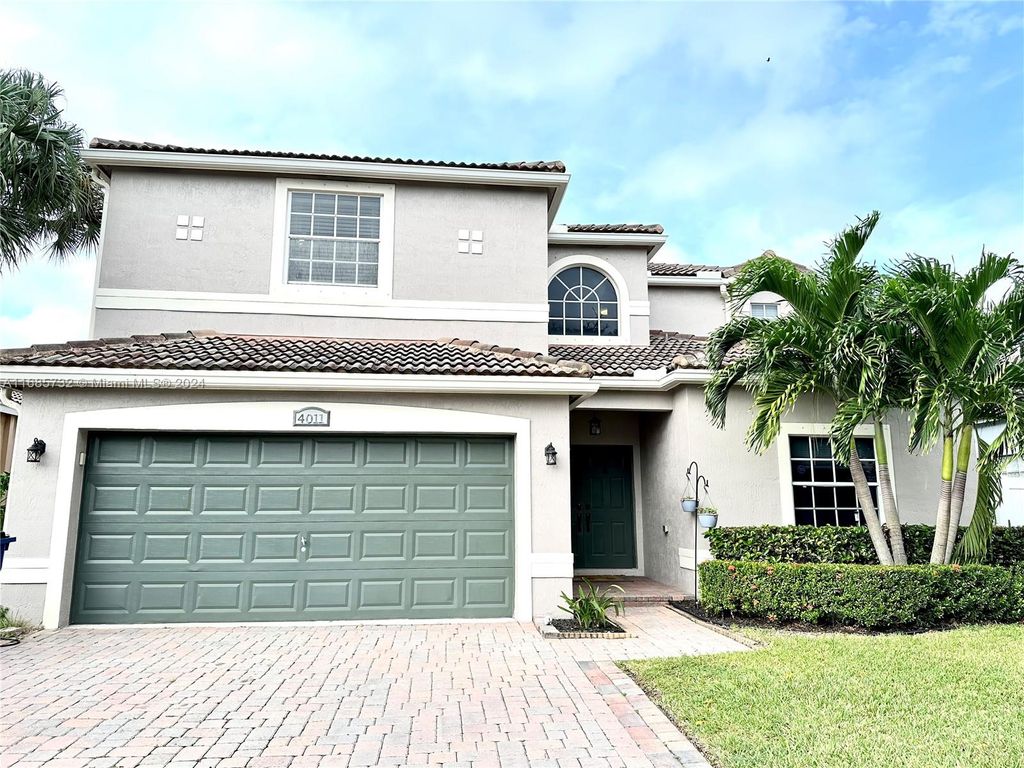 Photo of 4011 NW 62nd Ct, Coconut Creek, FL 33073 (MLS # A11685732)