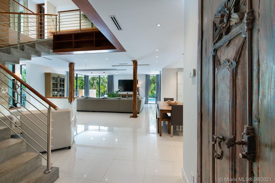 A rare find in the rapidly transforming hip MiMo Upper East side. Private gated 36,369SF DOUBLE LOT is a lush tame jungle w/ 175' of water frontage. New seawall, dock, private beach, 2 ponds, summer kitchen, large pool & zipline for kids. Two story elevated 3,300SF modern beauty built in 2015 w/ 4 en suite bedrooms all with balconies. Inviting foyer that welcomes you to a luminous open living/dining room & gourmet kitchen w/SS Gaggenau appliances. Floor to ceiling high impact sliding doors & windows makes for a bright cheerful space. All interior doors are antique art pieces imported from Bali. Architectural detailing by the artist Paul Hughes. Air-conned storage house, 6 canoes w/rack. Generator ready, smart lighting system, large laundry room, security system. Designated Nature Preserve.