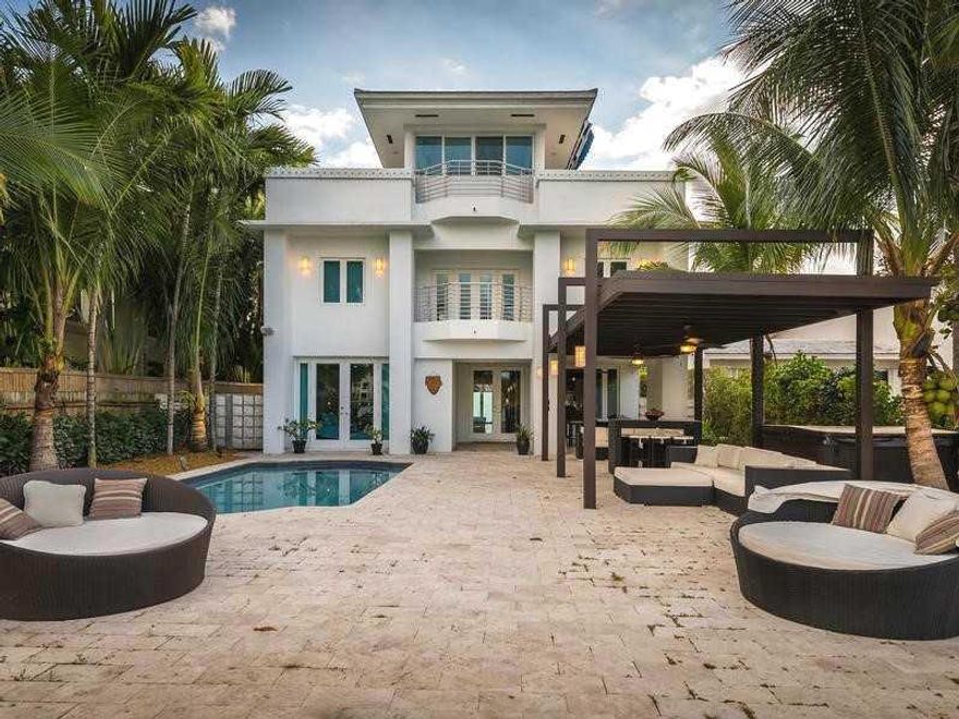 BACK ON THE MARKET!! An ideal price for a prime location on Palm island this enchanting property is one of a kind, completely renovated in 2014, roof top terrace with BAY views from every room. 36"x24" CARIBBEAN BLUE marble &wood floors throughout. State of the art Kitchen w/ granite countertops, an outdoor pergola from Luxapatio, hurricane impact windows, sound system, steam shower room, swimming pool, jacuzzi, and new Boat deck & seawall with 50Linear Ft of water frontage. Breathtaking views!