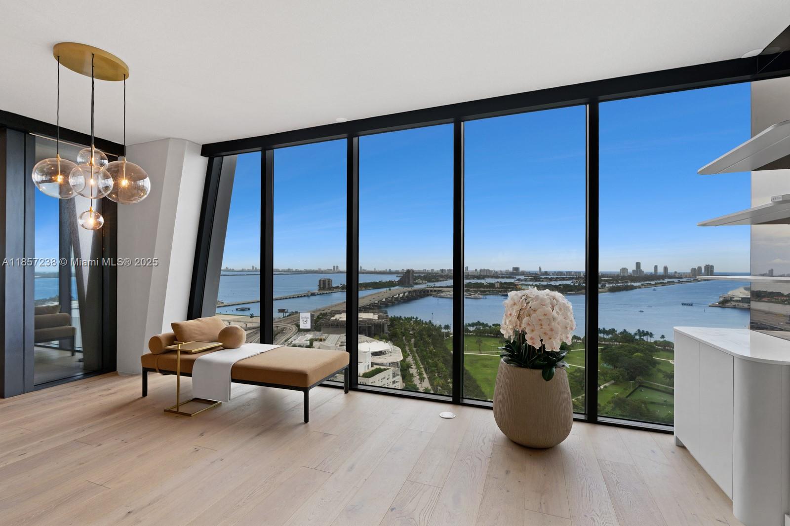 Stunning residence in The One Thousand Unit 2402 offers breathtaking panoramic views of the ocean and city skyline. Featuring floor-to-ceiling windows, an open-concept layout, designer finishes, and a gourmet kitchen with high-end appliances. Expansive private terrace perfect for indoor-outdoor living. Enjoy 5-star amenities: 24/7 concierge, infinity pool, luxury spa, fitness center, and valet. A rare opportunity to own in one of Miami’s most iconic luxury towers