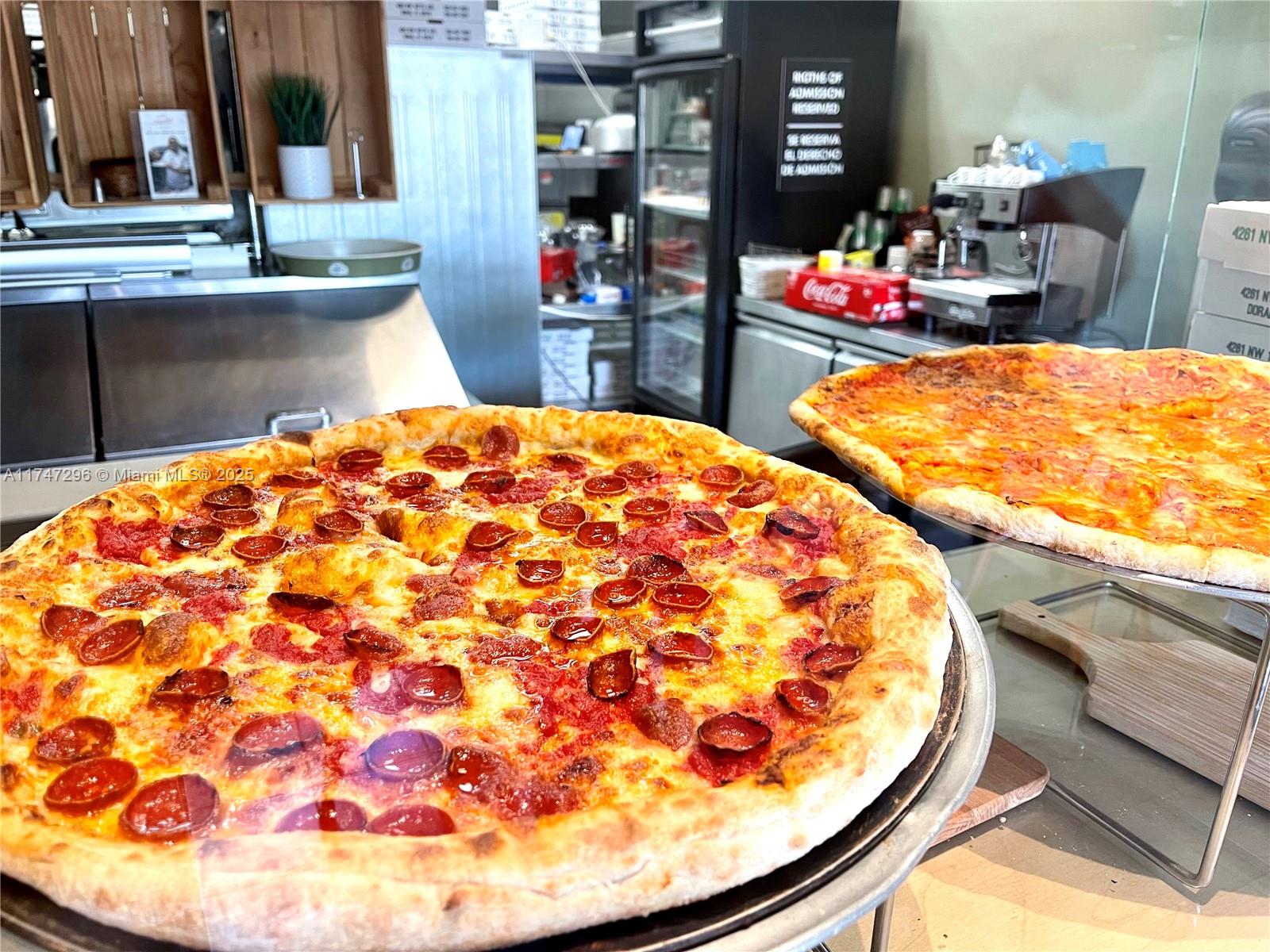 Prime Pizza Place. Impeccable 1,400 sqf space currently set up as a Pizzeria, located in a prime commercial plaza in one the busiest intersections of Doral, FL. This fully functioning, and equipped venue is an express ticket to bypass months of setup, permitting, and inspections. All equipment is in great working condition. High-capacity pizza oven. Two hoods. Grease trap. More than ten years of operating, choose to retain the established brand or create your own, starting your business in weeks, not months. Benefit from extended operating hours, high traffic, and ample parking. The sale includes all equipment, furniture, and options for lease rights (real estate not included).