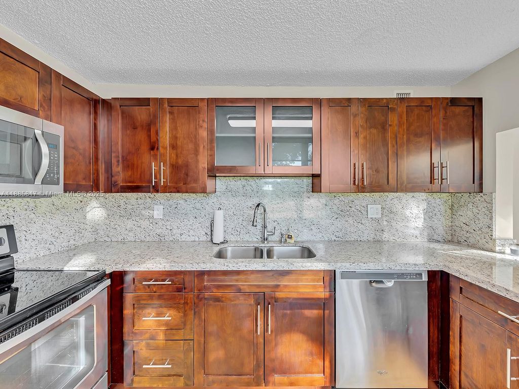 Photo of 9451 Evergreen Pl #104, Davie, FL 33324 (MLS # A11885817)