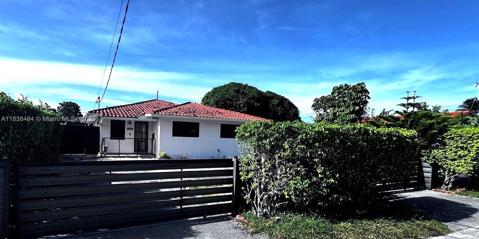 Originally a duplex, this charming 3-bedroom, 2-bath home is now a twin-home condo with shared ownership of the common land. NO ASSOCIATION!! Located just outside Coral Gables! Featuring new impact windows, newer washer/dryer and appliances, and tile flooring throughout. Enjoy the convenience of a fenced-in yard with a circular driveway. Situated in a prime location close to major transportation routes, shopping, and some of the area’s best restaurants. Minutes to downtown Miami and Coral Gables. Move-in ready and perfect for comfortable urban living!