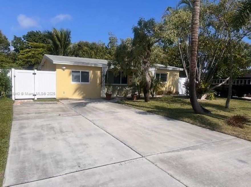 Located seconds from the water, marinas, & beach. NO HOA. Perfect Florida lifestyle home! Oversized lot with plenty of room for boat, trailers, or RV.   Meticulously renovated home. Stylish, functional & energy efficient. New roof, hurricane impact windows/doors, newer AC, new insulation, tankless water heater, fully updated electric, new stucco, freshly painted & new appliances throughout. Contemporary kitchen with white shaker cabinets, granite countertops, stainless steel appliances. Private backyard oasis with enormous screened-in patio & plenty of room for a full summer kitchen. Huge backyard with avocado, coconut & mango trees, storage shed, & custom landscape lighting. You really can have it all with this home! Call today for a private showing, it will not last long!