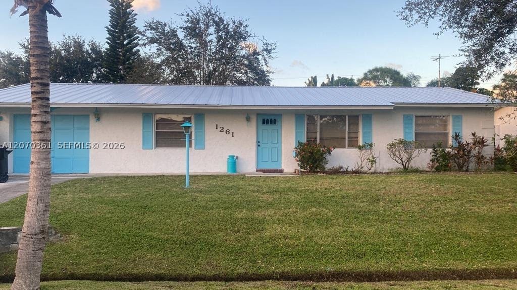 Photo of 1261 SE Mendavia Ave, Port St Lucie, FL 34952 (MLS # A12070361)