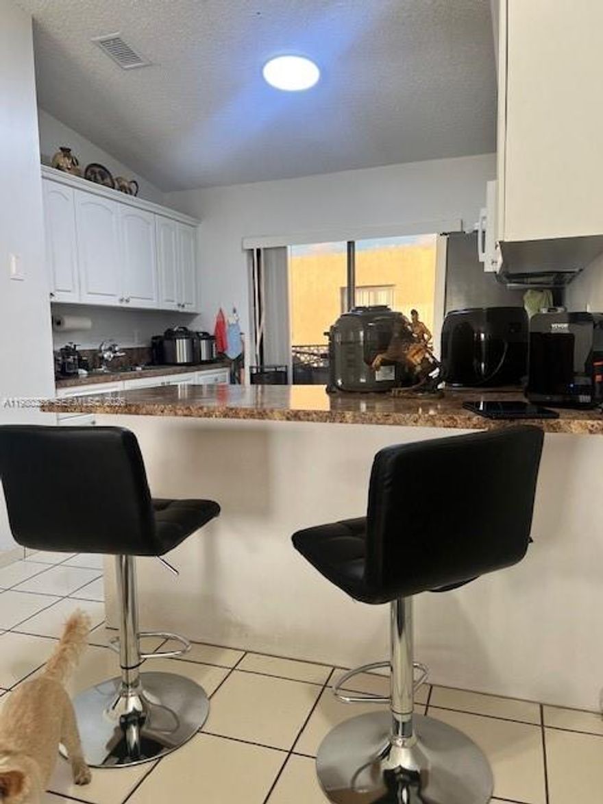 SPACIOUS & BRIGHT 2/2 WITH BLACONY, UPDATED KITCHEN AND APPLIANCES WITH TILE FLOORS THRUOUT.  A/C, TANKLESS WATER HEATER, UPDATED VANITIES AND TOILETS IN BOTH BATHROOMS. THIS UNIT FEATURES TWO ASSIGNED PARKING SPACES PLUS GUEST SPACES.  WASHER AND DRYER INSIDE.