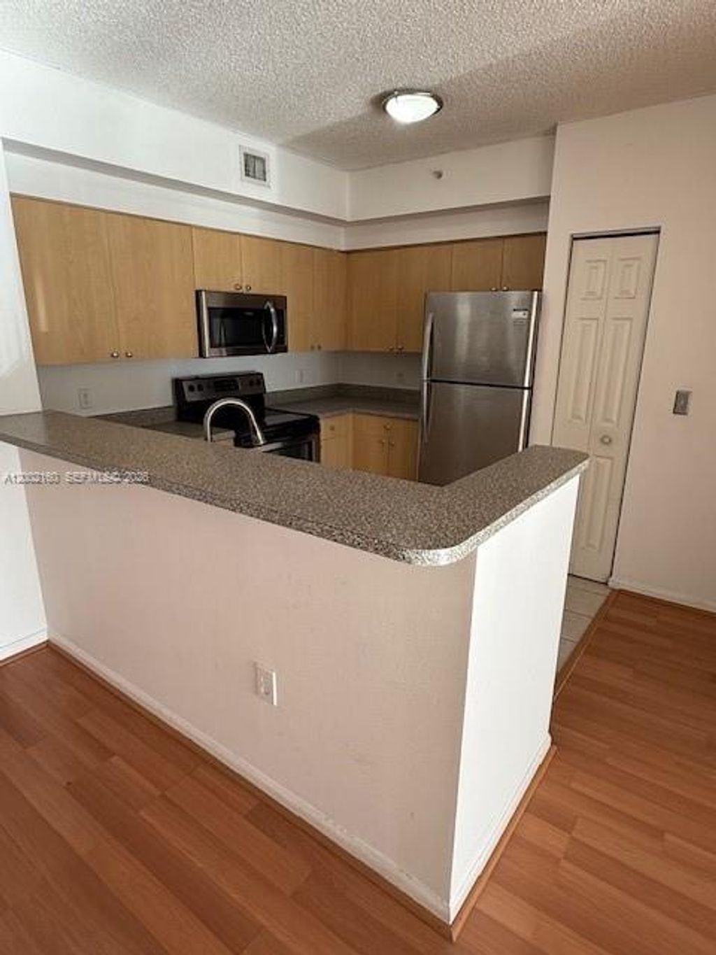 Photo of 8070 N Nob Hill Rd #205, Tamarac, FL 33321 (MLS # A12002160)