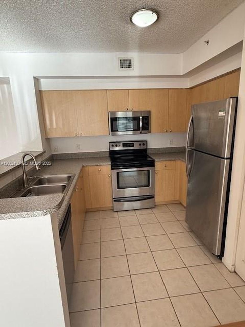 Photo of 8070 N Nob Hill Rd #205, Tamarac, FL 33321 (MLS # A12002160)