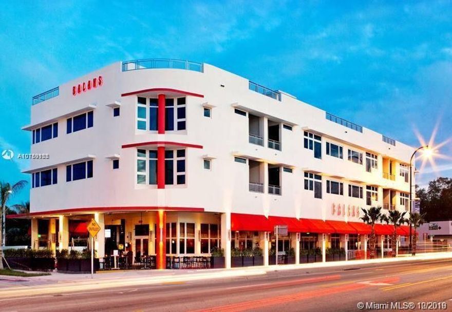 Amazing 1 BR MiMo loft-style apartment in iconic BALAN'S Building. Practically new, w/soaring 12FT ceilings, hardwood floors, balcony, marble baths w/modern Toto toilets, oversized bedroom, floor-to-ceiling impact windows, gourmet modern open kitchen, state of the art appliances + washer-dryer. Take the elevator to trendy La Placita Restaurant, or better yet, order in with Room Service. Walk to MiMo boutiques, restaurants, Farmer's Market, Legion/Morningside/Baywood Parks. Great live-work space in MiMo District, called Miami's hottest area by New York Times.