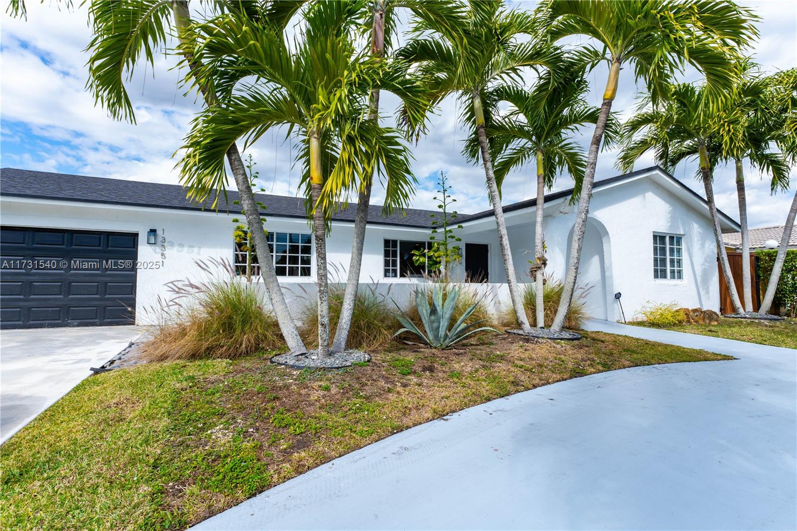 Lake Front Beauty, Enjoy evening Sunsets in this tranquil swimmable aquaforic Lake, use your Kayak or Paddle boards too. You are allowed to fish and use electrice boat. Such a unique home with 4 bedrooms, 2 baths, 1 car garage plus a circular driveway, gated yard, coconut trees, Tiki Hut w/Concrete floor and ceiling fans, covered patio for hosting gatherings or simply take in the peaceful scenery. SS New appliances, washer, dryer, remodeled. Live in this quiet neighborhood but at walking distance to fine dining, supermarkets. Turnpike acesss just mins. away. Near airport and the keys.