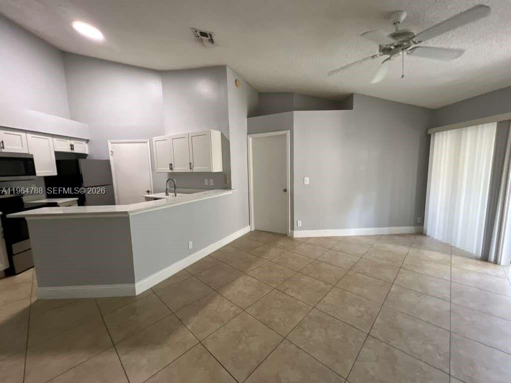 Photo of 9999 Summerbreeze Dr #715, Sunrise, FL 33322 (MLS # A11964788)
