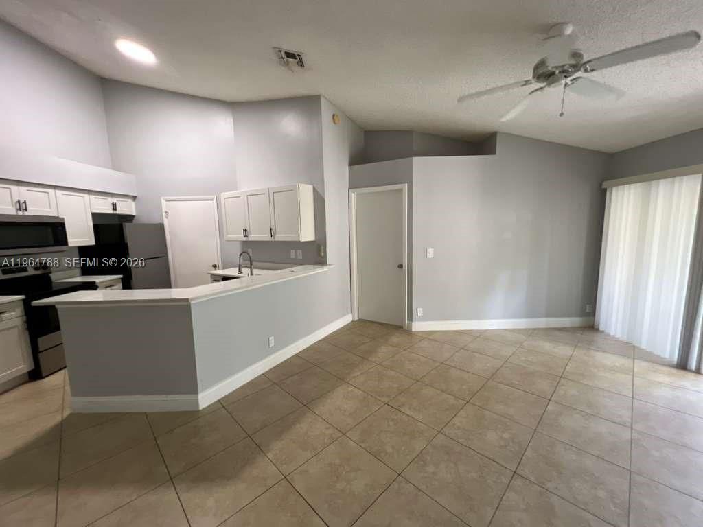 Photo of 9999 Summerbreeze Dr #715, Sunrise, FL 33322 (MLS # A11964788)