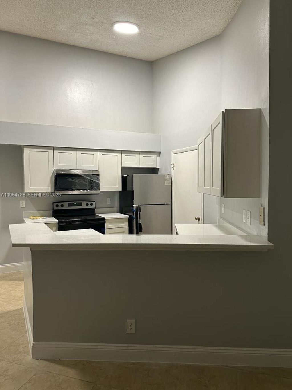 Photo of 9999 Summerbreeze Dr #715, Sunrise, FL 33322 (MLS # A11964788)