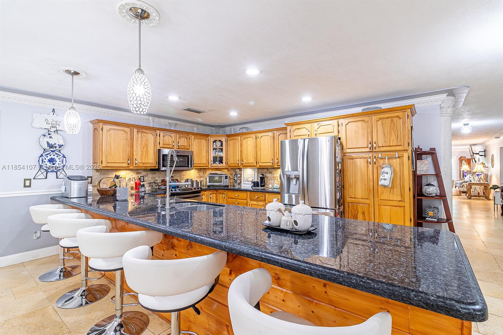 Redlands Estate Remodeled Pool Home with 2 cottages, enclosed pole barn and A/C cooled workshop on 2 acres with no neighbors! Incredibly rare opportunity to own a hidden gem with this much privacy and options. Main home has 3,279 sf with 3 en-suite bedrooms + Den and 3 bathrooms, 6 year old roof, 2 car garage, 2 A/C units, impact windows/doors, new master bath and more. Both cottages are renovated and have separate washer/dryer. Cottage 1 is a 3BR/1BA and Cottage 2 is a 2BR/2BA which have consistently generated legal AirBnB income. Enclosed 40x20 pole barn can be converted into a 3rd cottage. Separate Workshop is powered and features a new mini split A/C. Agriculture Exemption with 100+ fruit trees that produce $20-30k per year. Property is surrounded by 18 acres of nursery. No flood zone.