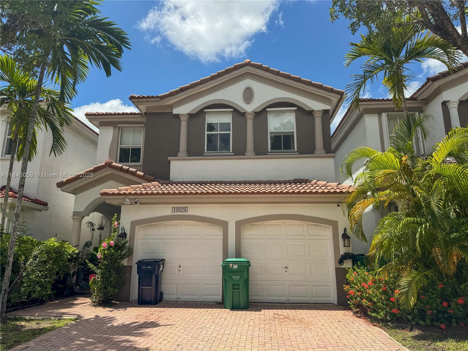Stunning 4-bed, 2.5-bath coach home in the desirable Isles at Doral! This spacious property features a 2-car garage, fenced backyard, and numerous upgrades including a modern kitchen with granite countertops and stainless steel appliances. Enjoy a freshly painted interior, window shades, and a dedicated EV charger. Located in a resort-style community with a pool and playground, just minutes from the Florida Turnpike, top-rated schools, and shopping centers. Don’t miss this move-in ready gem—schedule your private showing today!