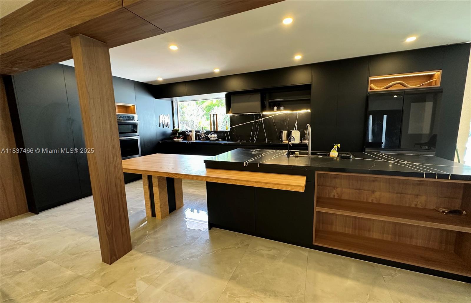 Completely remodeled in 2024, this stunning 3BD/2.5BA waterfront home blends Italian elegance with smart luxury. Features include a sleek open-concept Italian kitchen, Samsung appliances (2024, under warranty), and a dramatic wall unit with a built-in library and a 100” smart TV. The master suite impresses with a massive walk-in closet and a 120-pair shoe display. The ultra-modern bath offers dual sinks, dual showers, and smart heated toilets. Includes a grand piano, reclining beds, and designer furnishings. A guest suite with a separate entrance and 2 queen beds is built into the garage. Enjoy lakefront sunsets on your private sand beach, BBQ in the gazebo, and relax with 2 new A/C units (under warranty). This is waterfront living, redefined.