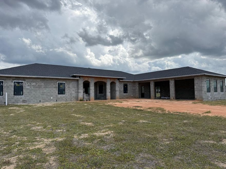 Huge 1.8 acre lot in one of the most desired private gated communities in Lake Placid Fl. This single family home with 4 beds/ 4 bath 4180 sq ft is under construction. The owner has already completed roof/windows, rough plumbing/air conditioning and electric. Concrete block /septic instillation and more. The buyer will need to complete the build and property is sold as seen. Full set of plans will be given to the buyer along with all the information the seller can provide. This is a great opportunity to take over a project or invest with great potential and build your dream home.