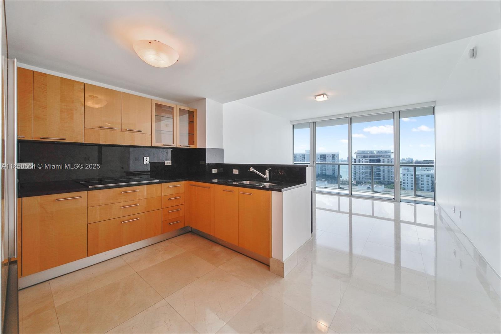 Experience oceanfront wellness living at The Carillon Miami Beach, renowned for its award-winning spa and health-focused amenities. This spacious and modern 1-bedroom, 1-bath residence offers sweeping city views from a large private balcony, perfect for sunset watching. The kitchen is equipped with premium appliances including a Sub-Zero refrigerator, Miele and Samsung ovens, and a stainless steel sink. Unit includes an in-residence washer and dryer. The primary bedroom features a walk-in closet, while the bathroom offers double vanities, a jacuzzi tub, and a separate glass-enclosed shower. Enjoy resort-style amenities including four pools, daily fitness classes, a full-service spa, sauna, and direct beach access.