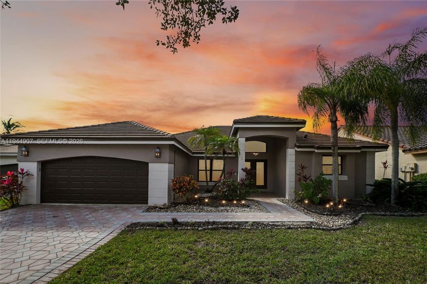 Stunning Waterfront Pool Home in the Highly Sought-After Lakes Community of Weston. Situated on a secluded cul-de-sac, nestled on a peninsula offering serene, expansive views of the lake. This exceptional single-story residence offers 4 bedrooms and 3.5 bathrooms, featuring a desirable split-floor plan with the primary suite privately situated on its own wing. The home showcases elegant porcelain tile throughout the main living areas, a beautifully renovated kitchen with granite countertops, double ovens, and new stainless steel appliances(2017).Enjoy formal dining, a spacious living room, and a separate family room—perfect for both entertaining and everyday living. Step outside to breathtaking sunset views over the water, widely considered among the most beautiful in the entire Lakes community. Recent upgrades include a new roof(2022), new impact windows 2021, Resurfaced Pool 2025, new appliances(2017), and water heater 2024, providing peace of mind and modern comfort. Located in desirable Weston with A-rated schools including Eagle Point, Tequesta, and Cypress Bay, and convenient access to major highways, the airport, and Sawgrass Mills Mall. A rare opportunity to own a move-in-ready waterfront home in one of Weston’s most sought-after neighborhoods.