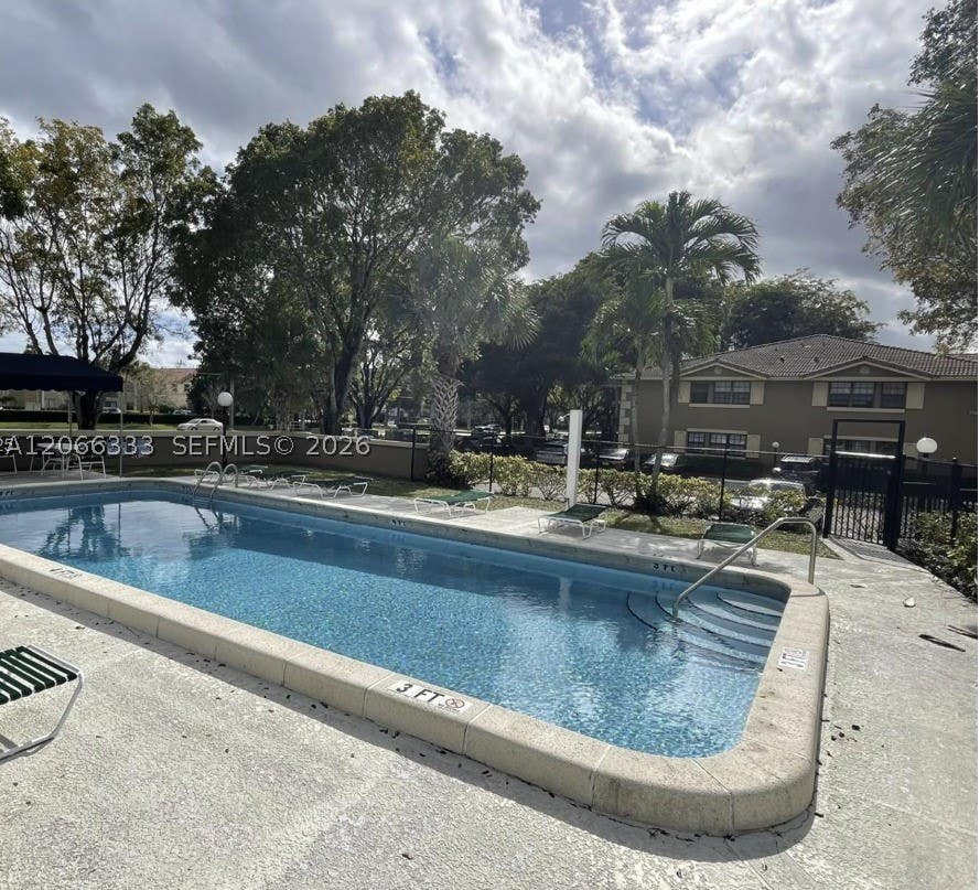 Photo of 2596 Riverside Dr #2596, Coral Springs, FL 33065 (MLS # A12066333)