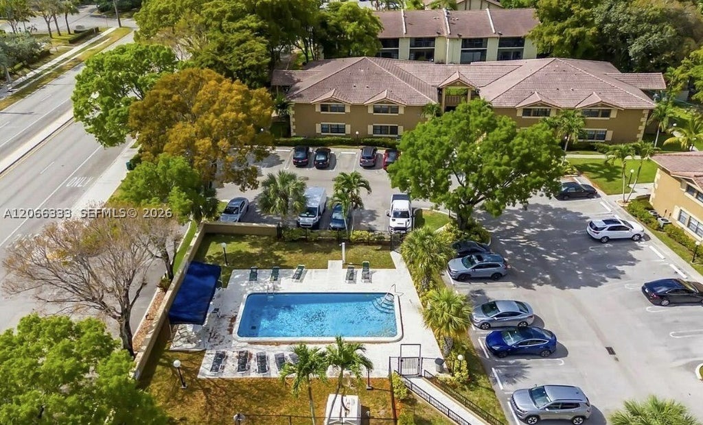 Photo of 2596 Riverside Dr #2596, Coral Springs, FL 33065 (MLS # A12066333)