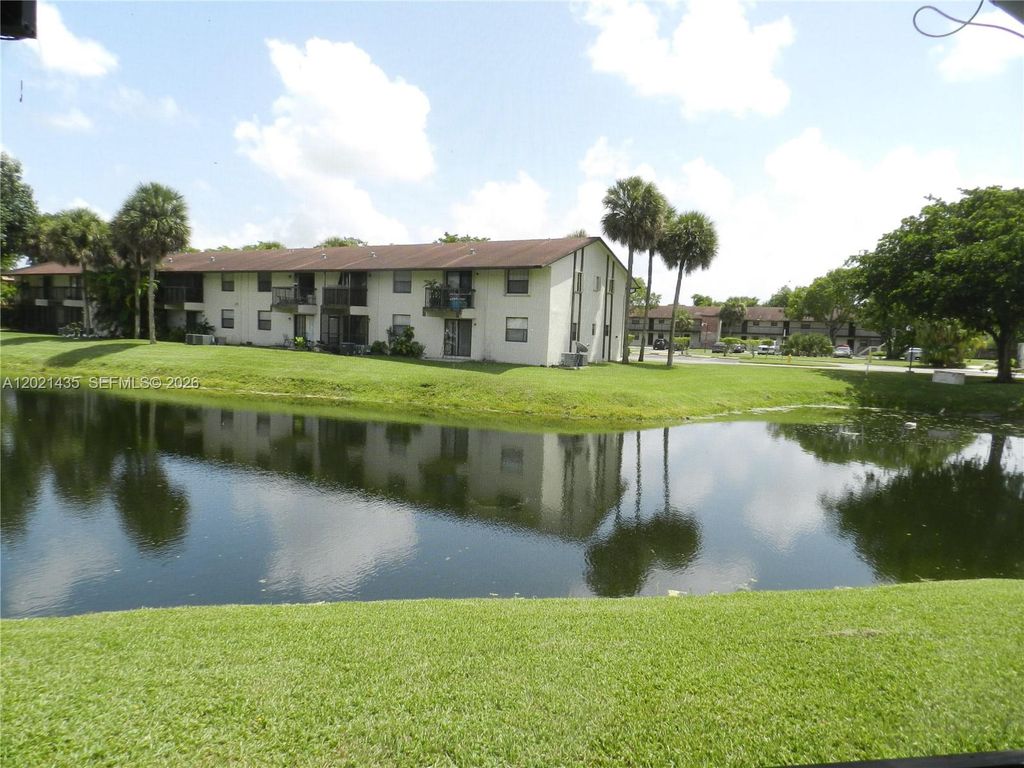 Photo of 6020 Shakerwood Cir #105, Tamarac, FL 33319 (MLS # A12021435)