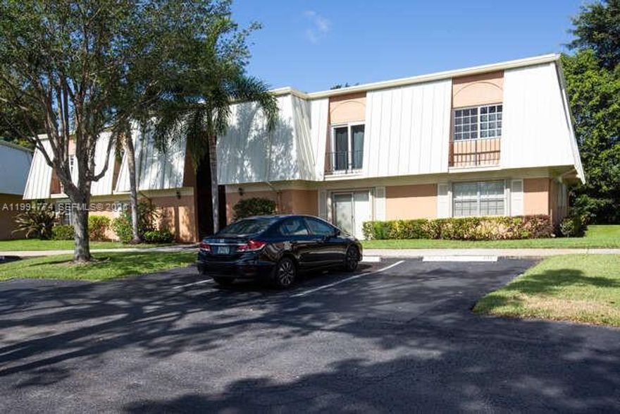 Discover this move-in ready 2-bedroom, 2-bath condo in the heart of Davie, offering the perfect blend of style, comfort, and convenience. Updated kitchen and bathrooms pair beautifully with sleek flooring throughout, while custom closet organizers maximize everyday storage. A versatile den/laundry room adds flexible space for a home office, gym, or additional storage. Enjoy peaceful moments on the screened patio—ideal for morning coffee or evening relaxation. Includes 2 assigned parking spaces. Prime location off Pine Island Road, just minutes to Nova Southeastern University, shopping, dining, and major roadways. Owner-occupant buyers required for the first year.