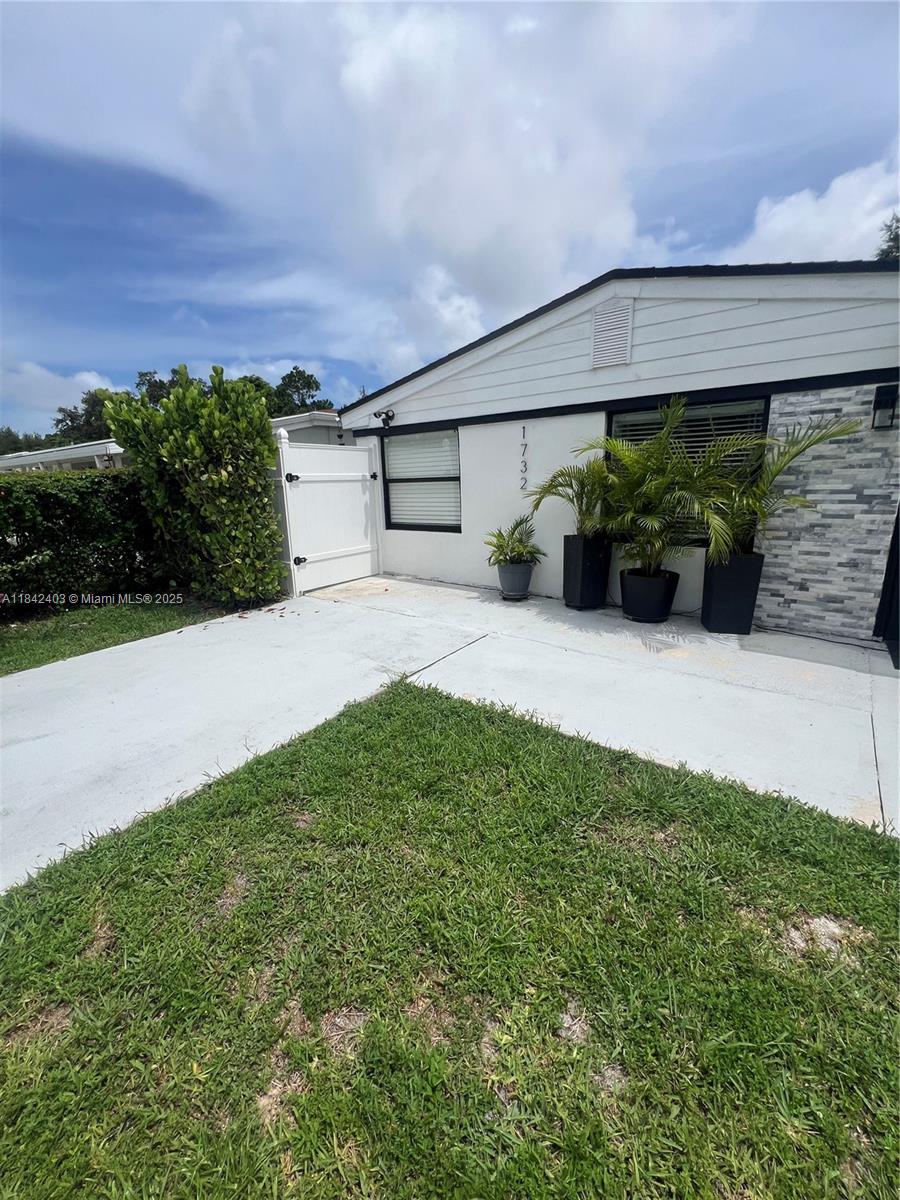 This 2-bedroom, 2-bathroom single-family home is located in a peaceful neighborhood with no HOA! The home features a bright and open concept kitchen and living area, brand-new flooring throughout, fully remodeled bathrooms, and an office space WITH BATHROOM. Rear access for added convenience. Additional highlights include INDEPENDENT laundry area. And an unbeatable location, just 10 minutes from the beach, and close to many shops, restaurants, schools, parks with pools, and more!