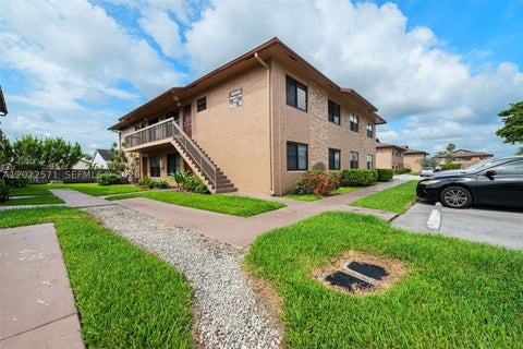 Photo of 10049 Winding Lake Rd #202, Sunrise, FL 33351 (MLS # A12022571)