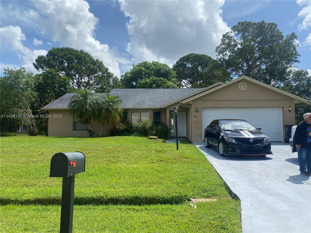 Photo of 1601 SE Nancy Ln, Port Saint Lucie, FL 34983 (MLS # A11459155)
