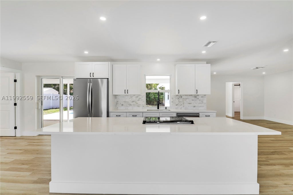 Photo of 404 Highwood Circle, Jupiter, FL 33458 (MLS # A11992559)